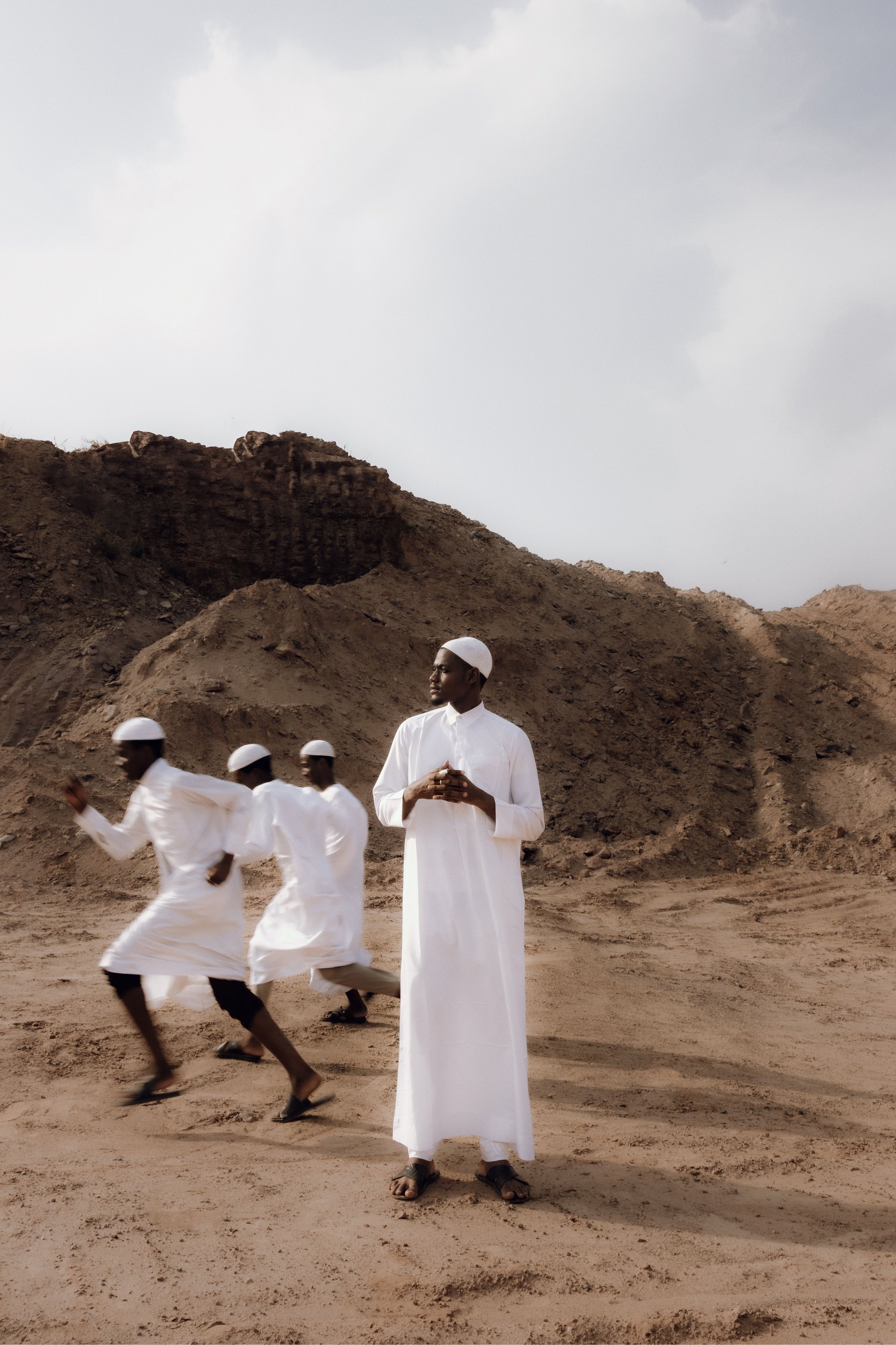 Men walking across a desert quarry