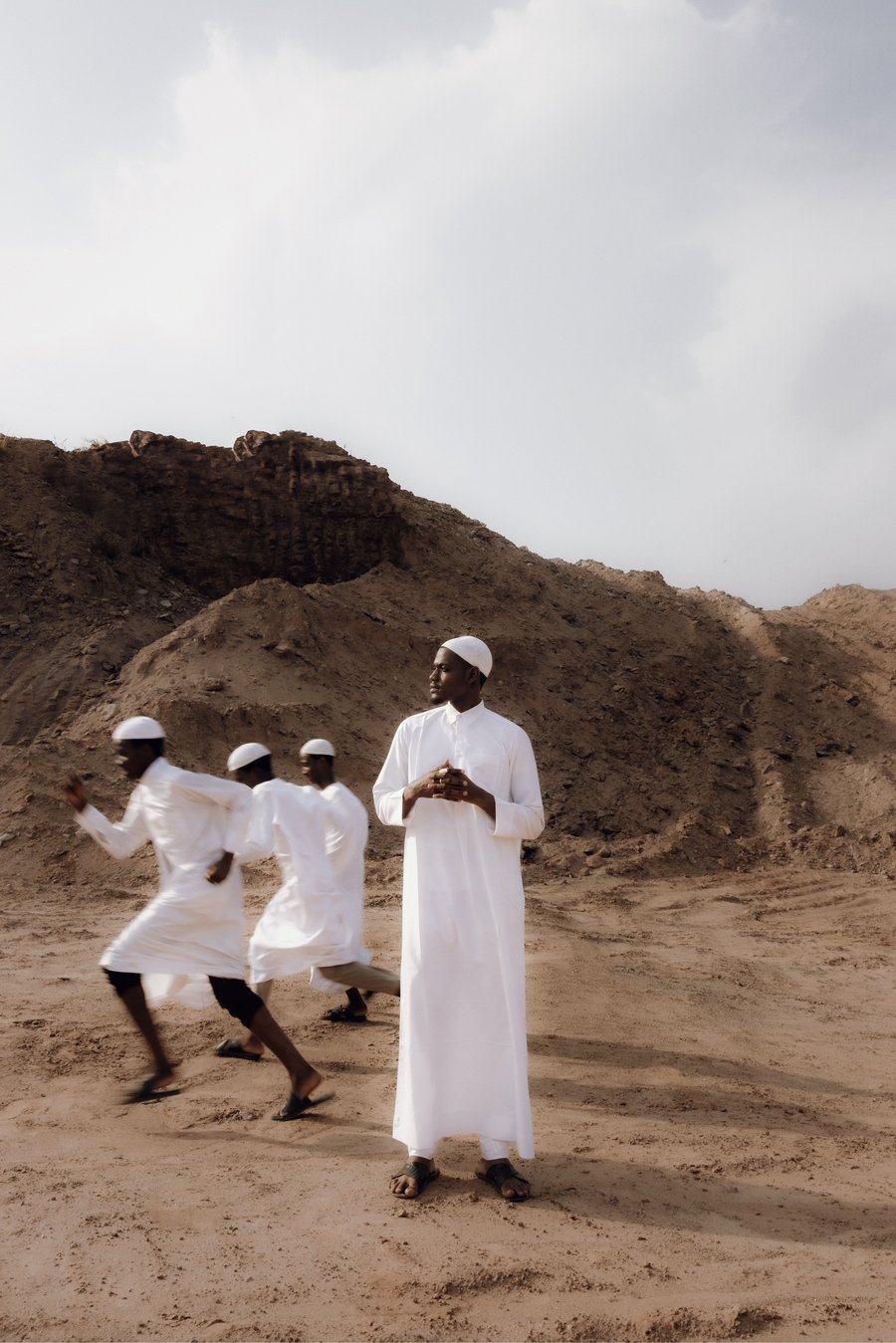 Men walking across a desert quarry